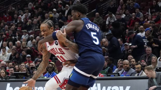 Feb 6, 2024; Chicago, Illinois, USA; Minnesota Timberwolves guard Anthony Edwards (5) defends Chicago Bulls forward DeMar DeRozan (11) during the first quarter at United Center.